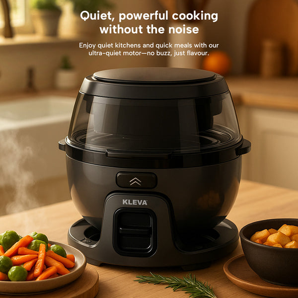 Kleva Rotating Crisp Air Fryer on a kitchen table with steamed vegetables and cooked potatoes nearby.