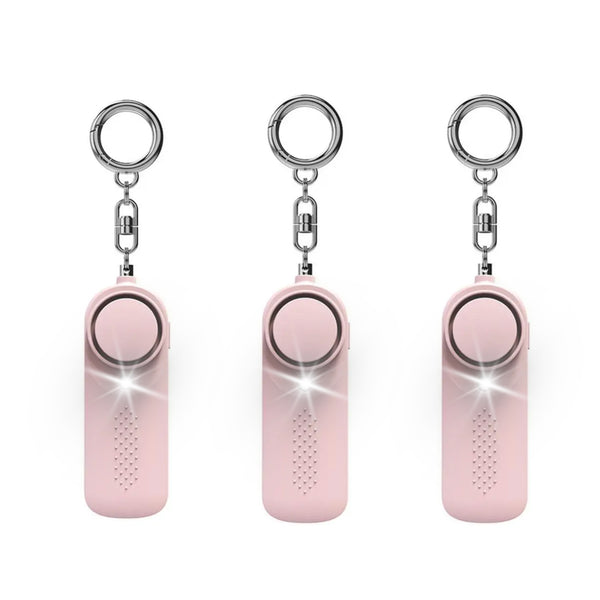 Three Pack pink personal safety alarms with LED flashlights activated