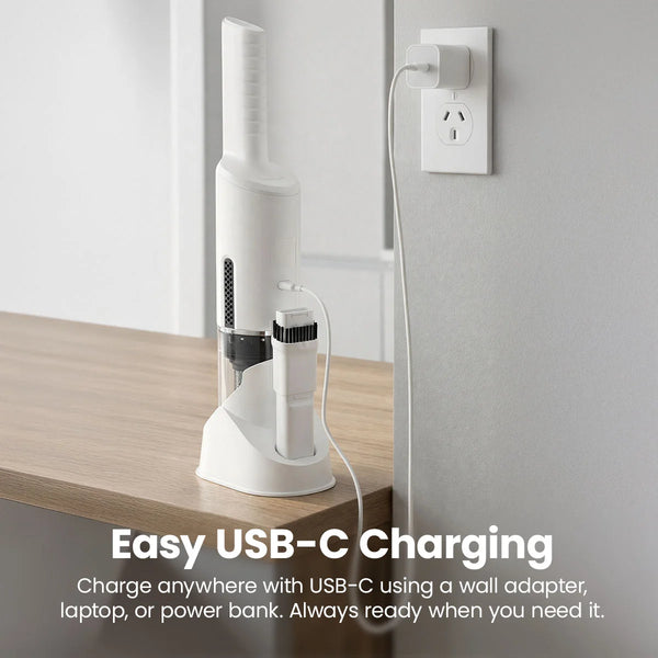 Cordless vacuum cleaner charging on a countertop using a USB-C charging dock and wall outlet