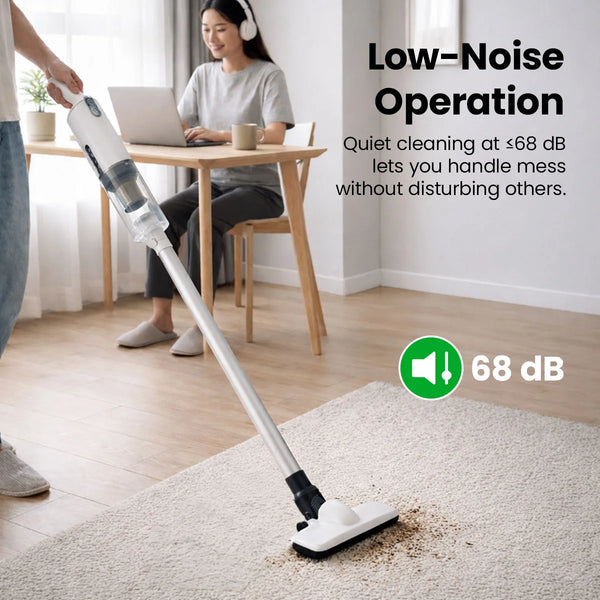 Quiet cordless stick vacuum cleaning a rug indoors with low-noise operation under 68 dB