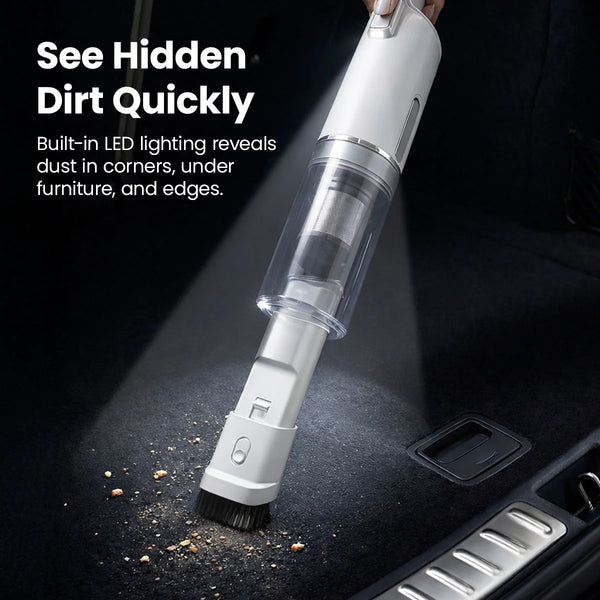 Handheld vacuum with built-in LED light revealing hidden dirt on car floor carpeting