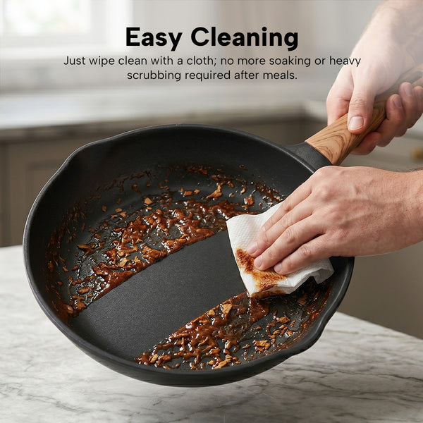 Non-stick frying pan being wiped clean with cloth showing easy cleaning and residue removal