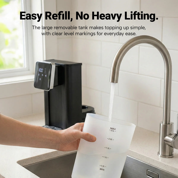 Removable water tank hot water dispenser being refilled under kitchen tap with clear level markings
