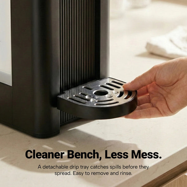 Detachable drip tray on hot water dispenser for easy cleaning and mess-free kitchen countertop