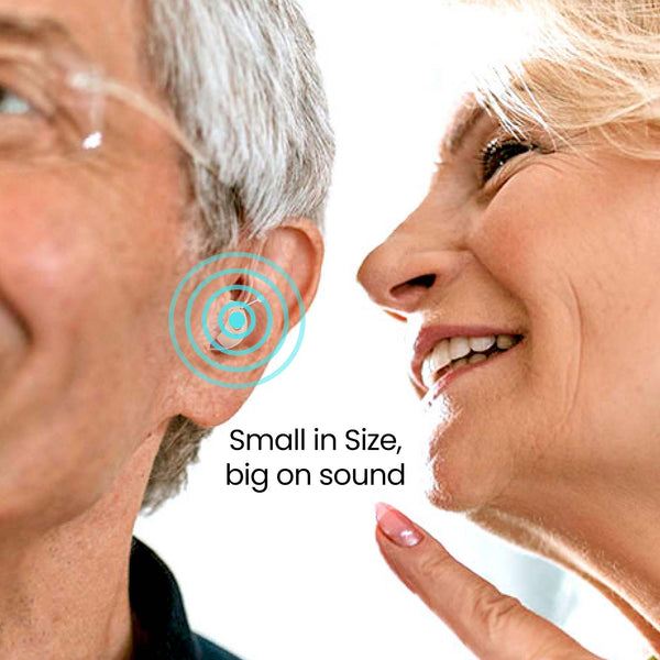 A woman smiles and points at a man’s ear, where a Kleva HearClear Mini Rechargeable Hearing Sound Amplifier by Kleva Range is discreetly visible. Blue rings highlight the device. Text reads, “Small in Size, big on sound.”.