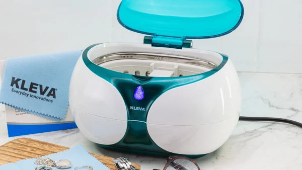 Kleva Sonic ultrasonic jewelry cleaner with an open lid, used for cleaning rings, watches, and glasses.