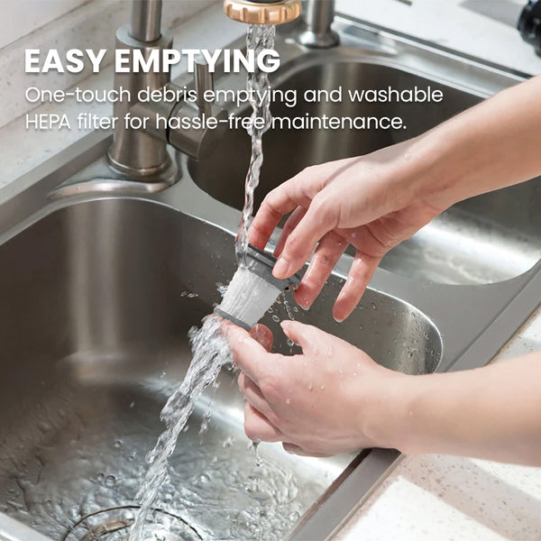 A person rinses the KRAPOF® Portable Mini Plus Handy Cordless Car Vacuum Cleaner’s lightweight HEPA filter by Kleva Range under a faucet, highlighting its easy-to-empty, washable design for simple maintenance.