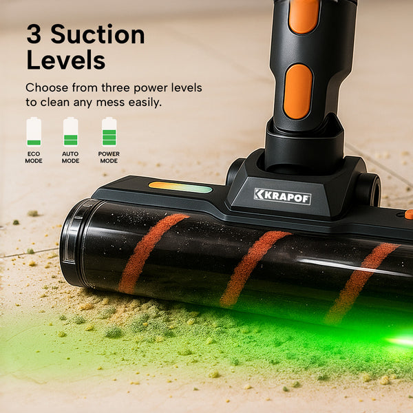 Close-up of Krapof Auto Clean Power Q3 vacuum head with green LED light illuminating dust on tile floor.