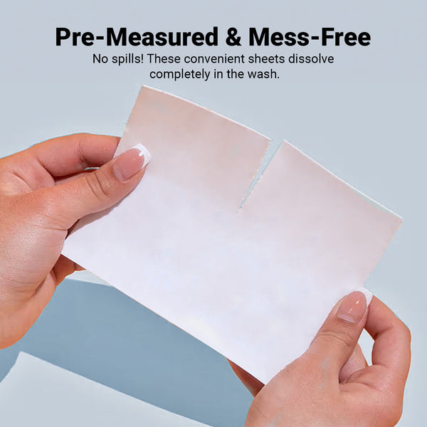 A pair of hands holds a rectangular Kleva Range Stain Lifting Laundry Detergent Sheet (Fresh Linen, 40 Sheets) with a perforated line. The light blue background has text: “Pre-Measured & Mess-Free”—ideal for plastic-free laundry.