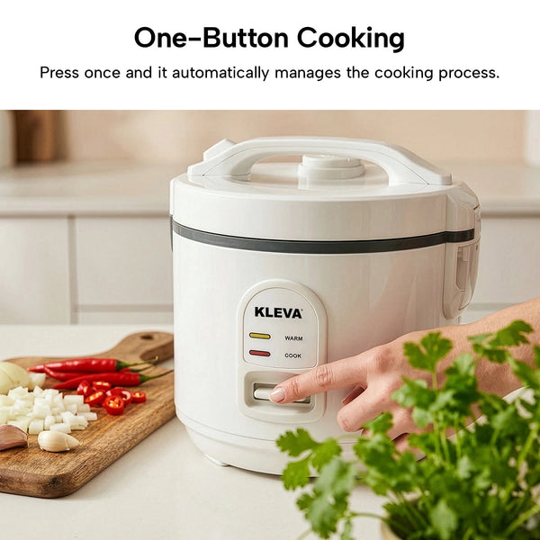 Kleva rice cooker with a hand pressing a button, surrounded by ingredients on a kitchen counter.