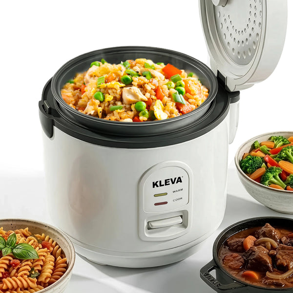 White rice cooker with a dish of fried rice, surrounded by other dishes of food on a white background.
