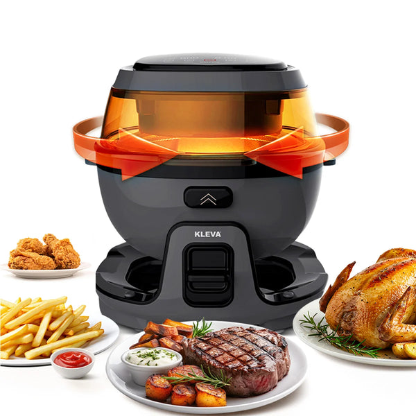 A black and orange Kleva® Spin Crisp Rotating Digital Air Fryer 6L by Kleva Range is shown, surrounded by cooked food such as fried chicken, fries with ketchup, a steak with potatoes, and a whole roasted chicken garnished with herbs.