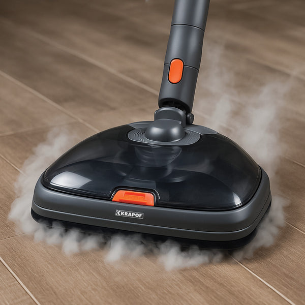 A KRAPOF® S3 Steam Drive Extension 2 in 1 Floor and Steam Mop for Q3 Stick Vacuum by Kleva Range, with a black and gray head, releases visible steam as it cleans a brown tiled floor. The Kleva Range logo appears on the mop head.