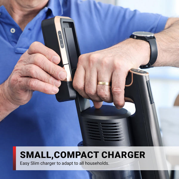 A person wearing a blue shirt and watch inserts the Power Pack Battery for KRAPOF® Super Slim Power Vacuum by Kleva Range. Text below reads, "SMALL, COMPACT CHARGER. Easy slim charger to adapt to all households.