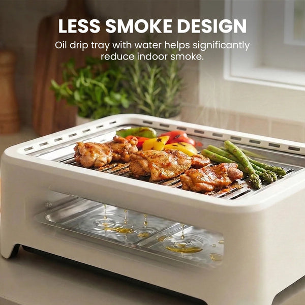 Indoor smokeless grill with water drip tray reducing smoke while grilling food