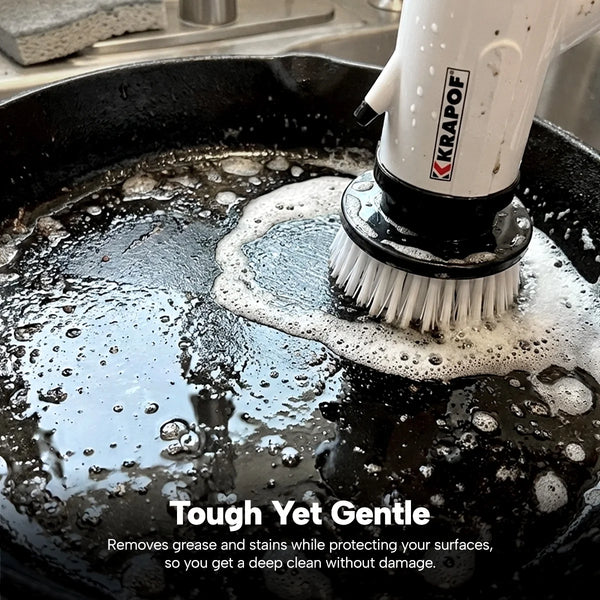 Electric spin scrubber removing grease from a stovetop pan with powerful rotating brush head