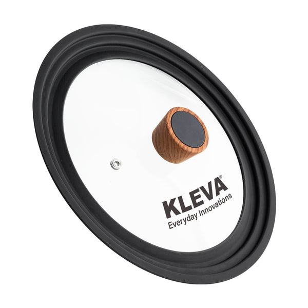 The Diamond Earth® Universal Glass Lid 24-28cm by Kleva Range features a round glass design with a black silicone rim and wooden handle, branded on the surface. It fits 24-28cm pots and is perfect as a Diamond Earth pan lid.