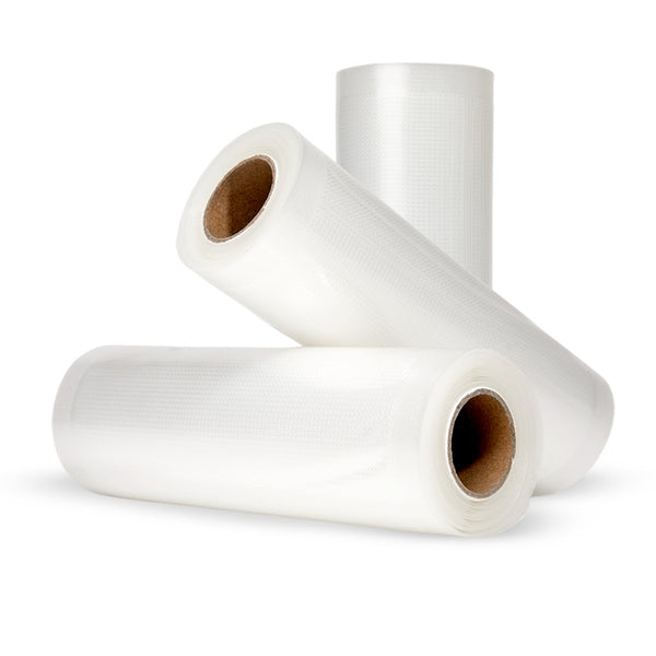 Three rolls of Kleva® Vac Seal & Save Bags by Kleva Range are displayed—two flat, one upright, showing cardboard cores. BPA free, they're perfect for food storage and keep your food 5 times fresh against a white background.