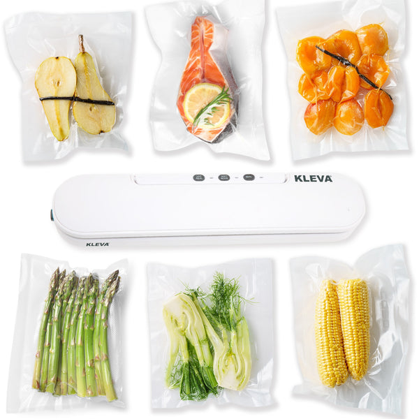 Six vacuum-sealed bags with various foods surround a white Kleva® Vac Seal & Save Food Saver Vacuum Sealer by Kleva Range, highlighting how this appliance keeps food fresh; includes FREE sealer bag rolls.
