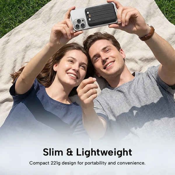 Couple lying on a blanket outdoors, holding a phone with a slim and lightweight phone case displayed.