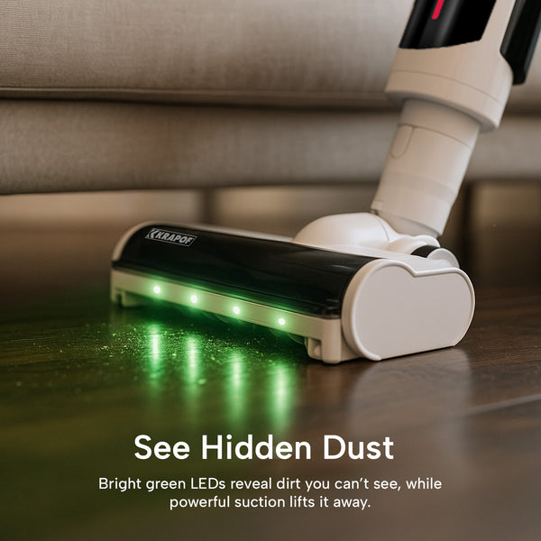 The KRAPOF® Compact Clean Self-Empty Cordless 2-in-1 Handy Vacuum Cleaner + Stick Vac by Kleva Range uses green LEDs to reveal hidden dust on hardwood floors, while its powerful suction lifts it away. Text: See Hidden Dust.