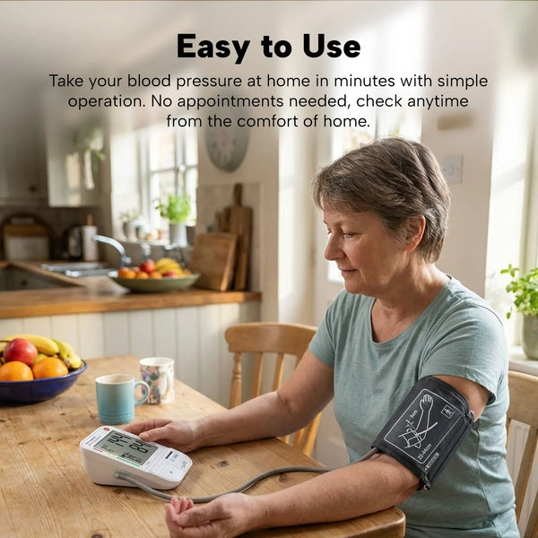 Woman using digital blood pressure monitor at home with arm cuff for easy and convenient health tracking