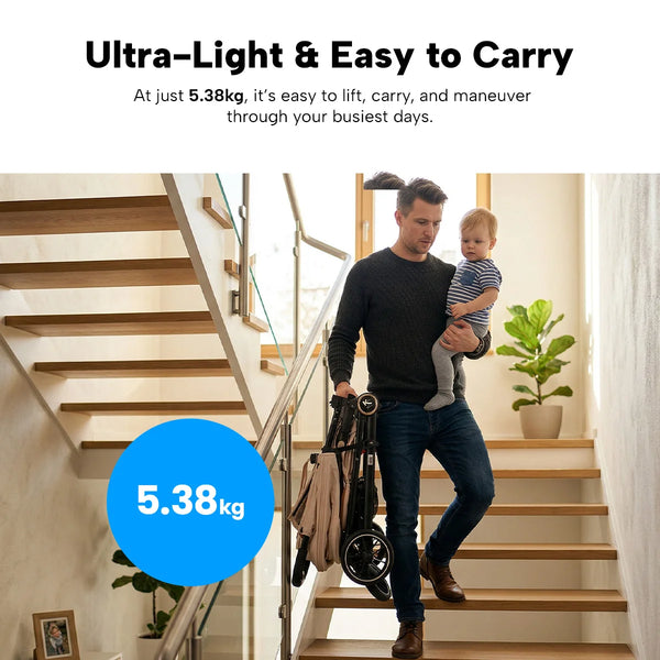 A man descends stairs with a child in one arm and the KLEVA® KoziKids Compact & Lightweight Travel Stroller (just 5.38kg) by Kleva Range in the other—ultra-light, easy to carry, and ideal for busy parents on the go.