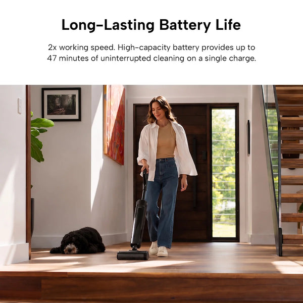 A woman cleans a wooden floor with the KRAPOF® FX5 Cordless Hard Floor Washer from Kleva Range in a modern home while her black dog rests nearby. Text above highlights up to 47 minutes of cleaning per charge for long-lasting battery life.