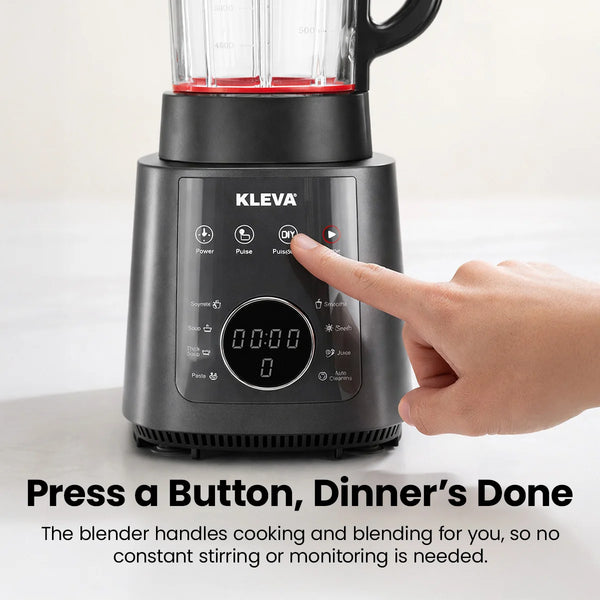 Close-up of the Kleva Mealio digital interface showing a finger pressing the smart preset buttons for automatic cooking and blending.