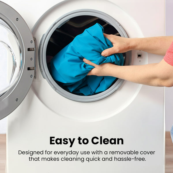 A person places a blue fabric cover into the open door of a front-loading washing machine. Text reads, “Easy to Clean. The KLEVA® Posture Chair by Kleva Range has a removable cover for quick cleaning and daily convenience.”.