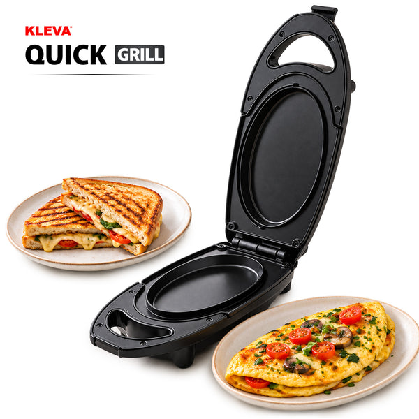 A black KLEVA Quick Grill by Kleva Range with non-stick plates sits open and empty, featuring a grilled sandwich on one plate and a vegetable omelette placed on another plate nearby.