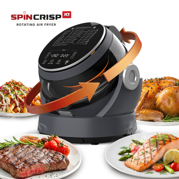 The Kleva® Spin Crisp IQ Rotating Digital Air Fryer by Kleva Range features 360° auto-rotate technology. Surrounded by plates of chicken, steak, and salmon, orange arrows show rotation as its control panel displays various cooking settings.