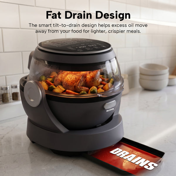 The Kleva® Spin Crisp IQ Rotating Digital Air Fryer by Kleva Range is shown cooking a whole chicken and vegetables. Its 360° auto-rotate and tilt-to-drain design with a DRAINS tray collects oil, with kitchen items in the background.