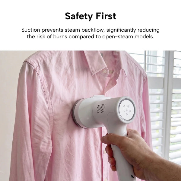 A person uses the Kleva Range KLEVA® AirPress, a white handheld garment steamer with self-suction, on a pink button-up shirt hanging by the window—no ironing board needed. Text highlights the KLEVA® AirPress’s safety features.