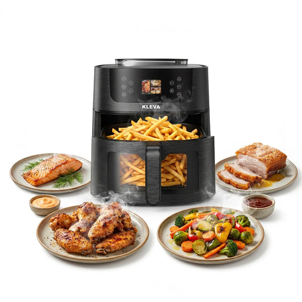 The KLEVA® SteamCrisp IQ Steam Air Fryer with Smart Food Detection 8L by Kleva Range, seen here in black and filled with french fries, is surrounded by plates of salmon, chicken wings, roasted veggies, pork with gravy, and dipping sauces on a white background.