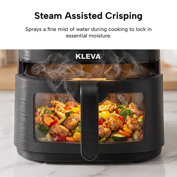 A black Kleva Range KLEVA® SteamCrisp IQ Steam Air Fryer with Smart Food Detection 8L features a clear front window displaying chicken and veggies inside, steam visible. Above, text reads: Steam Assisted Crisping. Smart food detection ensures perfect results.