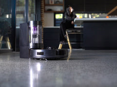 The robot parked back on its dock on a polished concrete floor.